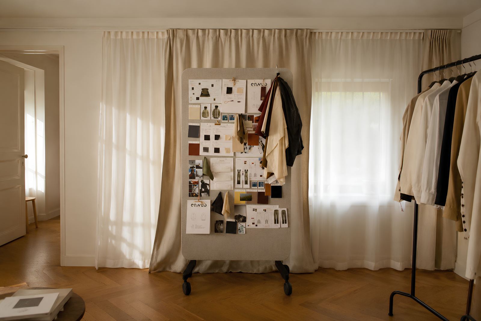 Studio with moodboard and clothing rails